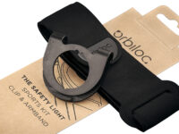 Orbiloc Sports kit (armband + clip) met verpakking op een witte achtergrond.